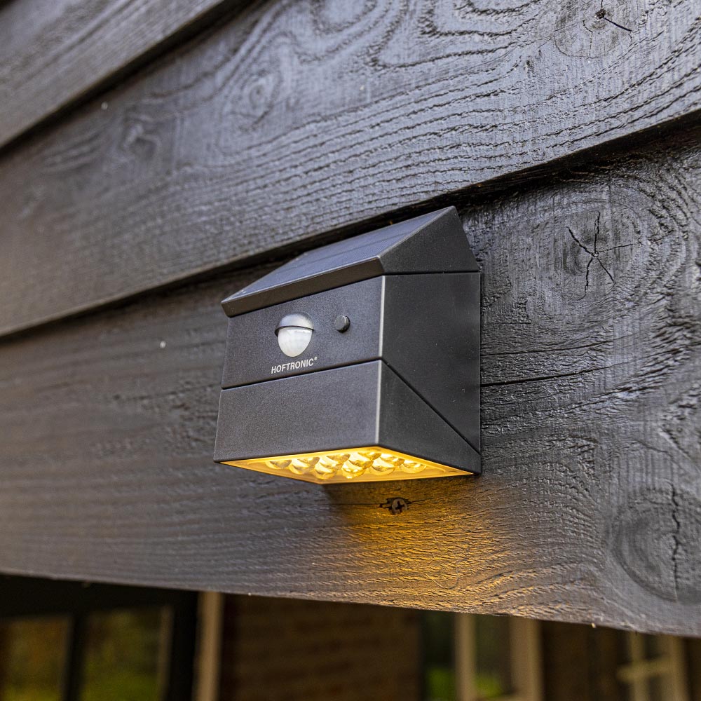 Cubos on a fence with a turned solar panel