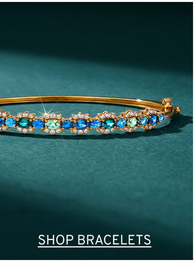 Gold bangle bracelet with a line of blue and aqua gemstones, each one circles with tiny diamonds. Click to Shop Bracelets