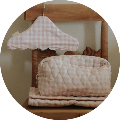 Pink Gingham Toiletry Pouch and Hanger sitting on chair