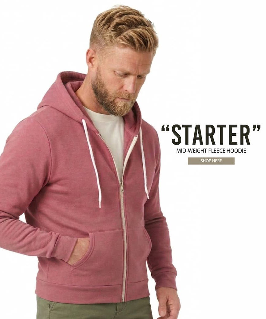 Handsome blonde man in a wine light hoodie and olive shorts and cream tee shirt made in usa