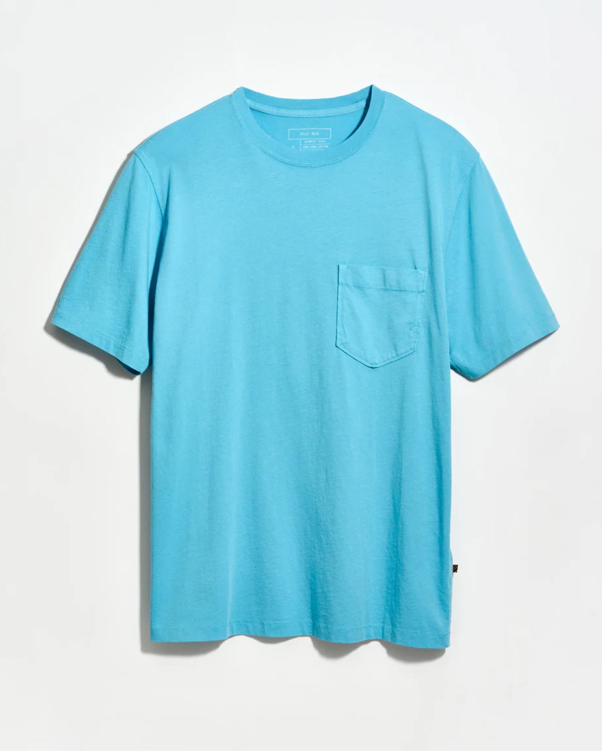 Blue tee on a grey background.