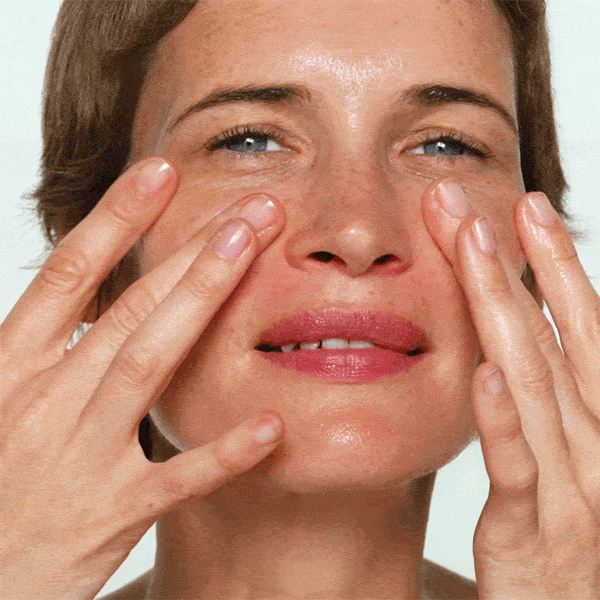 GIF, close up of model applying skincare