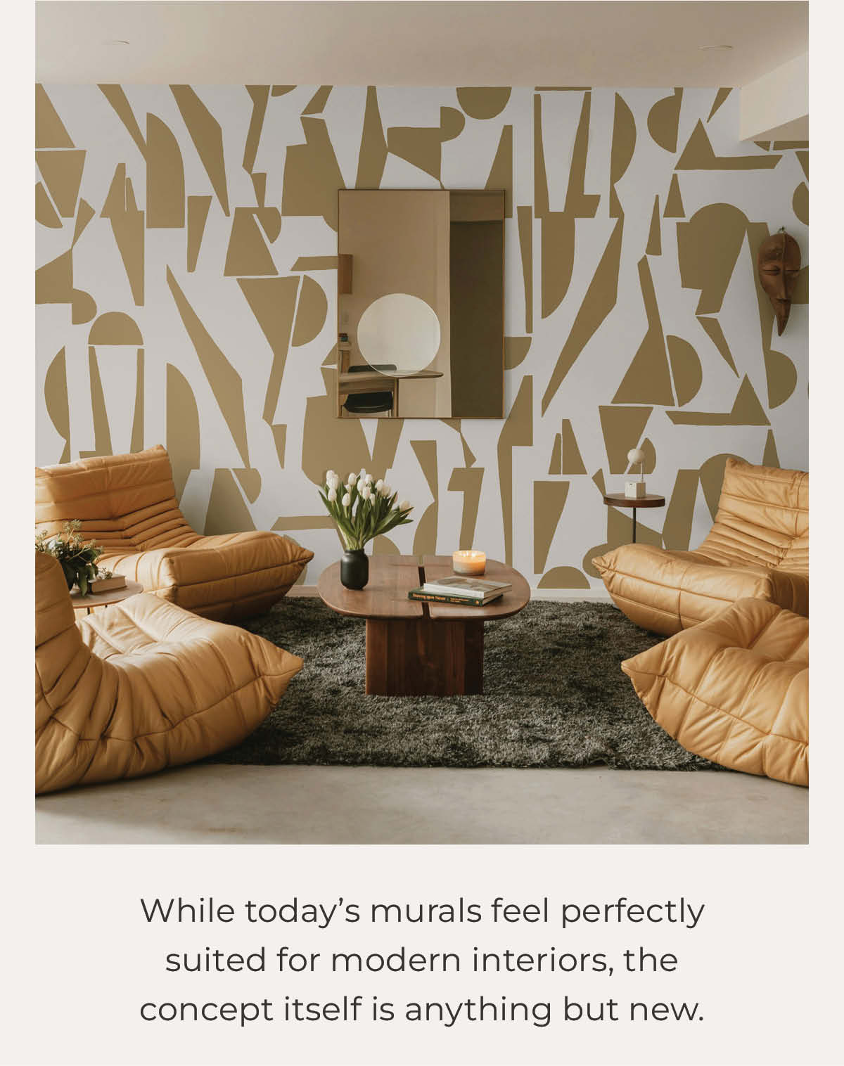 Image of Tempaper's Enigma wall mural in gold and white in a living room. Text below image "While today's murals feel perfectly suited for modern interiors, the concept itself is anything but new."