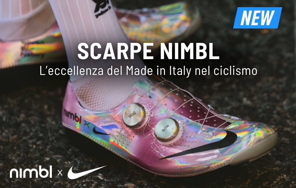 Iridescent pink Nimbl x Nike cycling shoe with two BOA dials on road surface, new product badge
