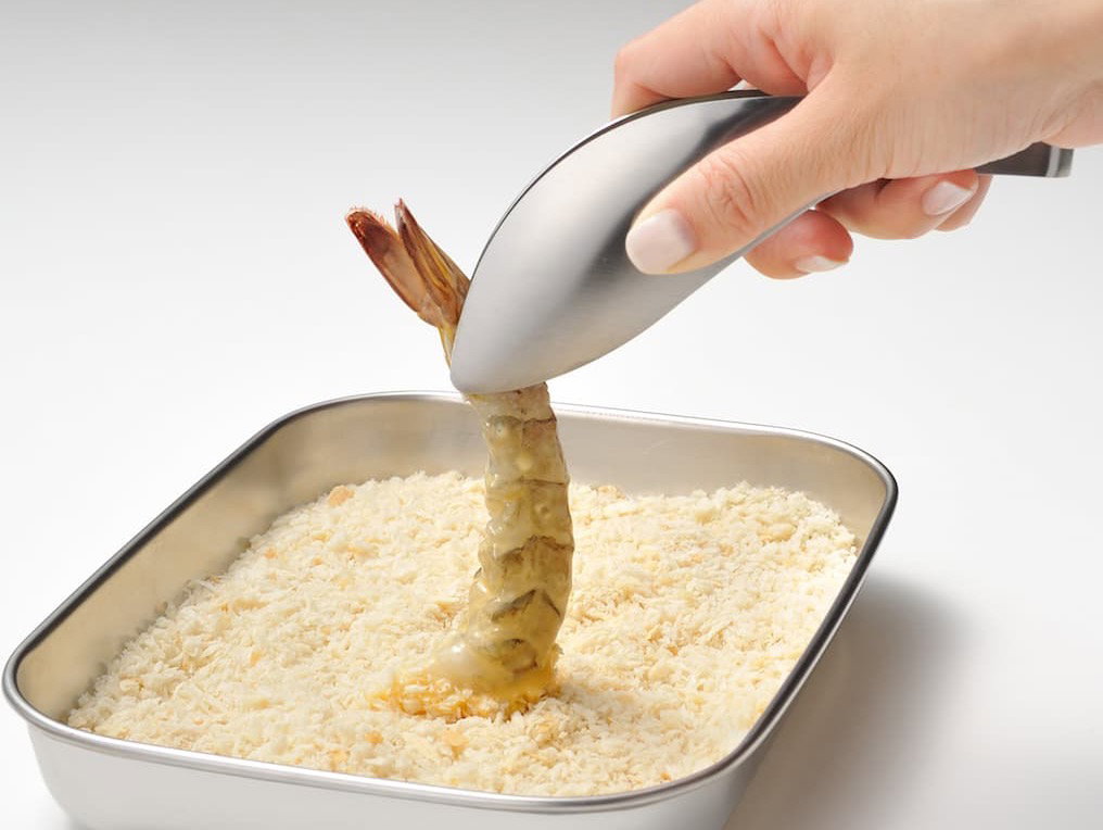 Tongs breading seafood