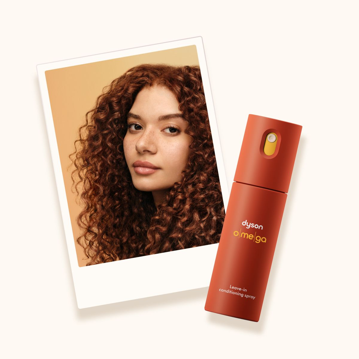 Model with curly hair uses the Dyson Supersonic Travel hair dryer to dry her hair.