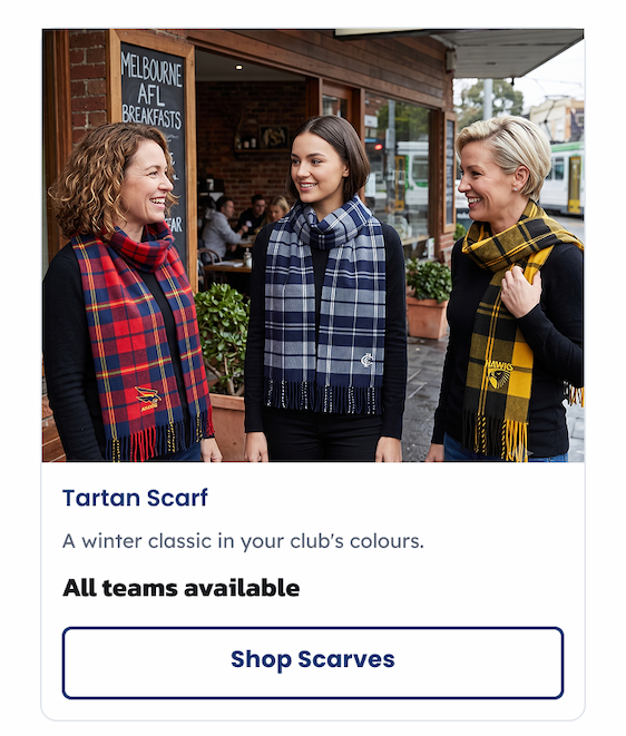 Three women outside a cafe wearing AFL Tartan Scarves