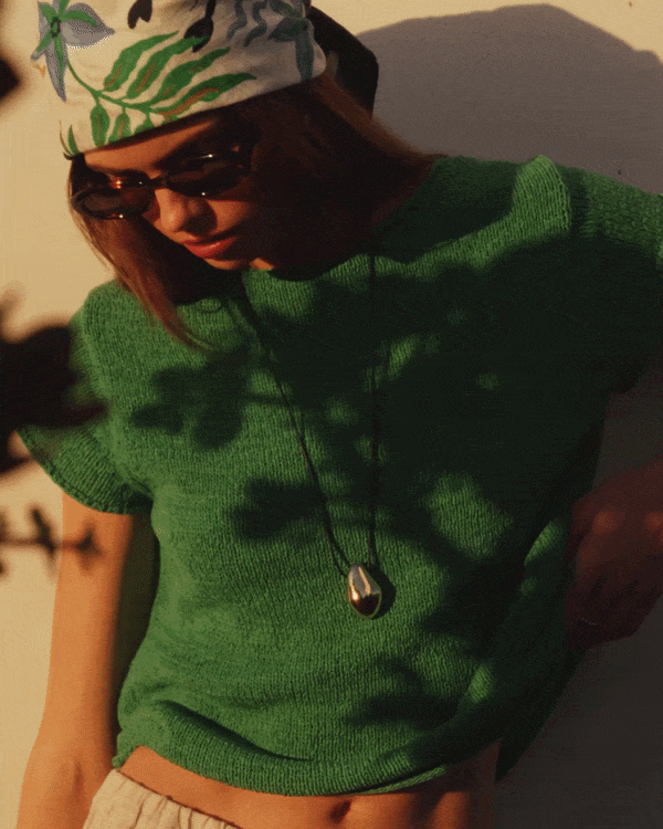 Gif Video shows a model wearing the Milou Sweater Top in Palm.