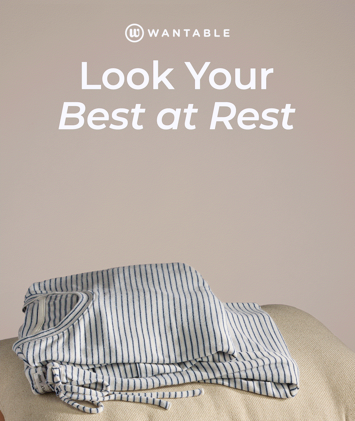 Folded floral and striped pajamas stacked with a pink lounge set on a beige surface.