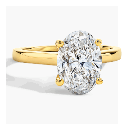 Yellow gold oval diamond solitaire ring with smooth band.