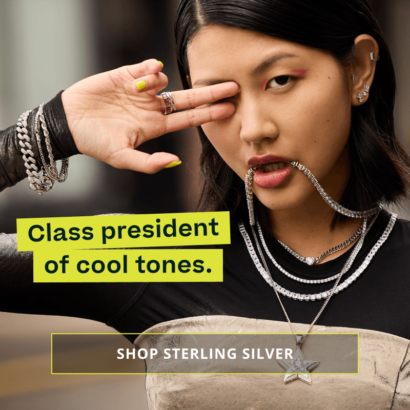 Model in bold, and thick silver & diamond pendant chains, bracelets, rings & stud ear stack. Class president of cool tones. Click here to shop sterling silver