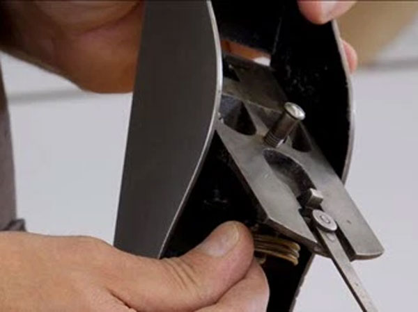 Adjusting a hand plane blade