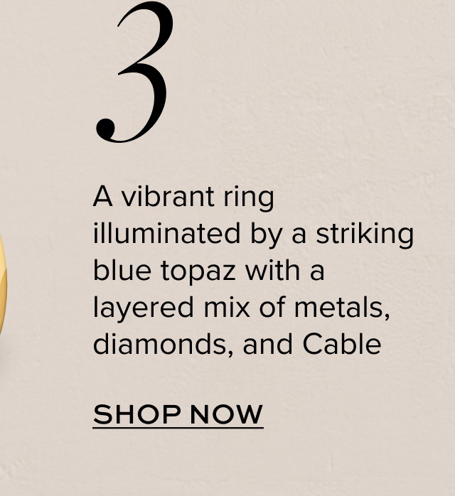 A vibrant ring illuminated by a striking blue topaz with a layered mix of metals, diamonds, and Cable