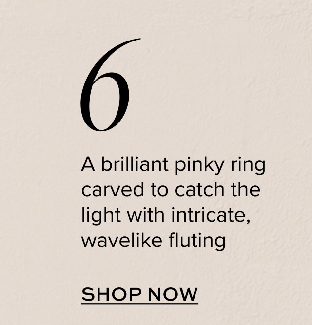 A brilliant pinky ring carved to catch the light with intricate, wavelike fluting