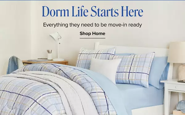 Dorm life starts here. Everything they need to be move in ready. Shop home. A made bed with a blue and white plaid design and matching pillows and sheets.