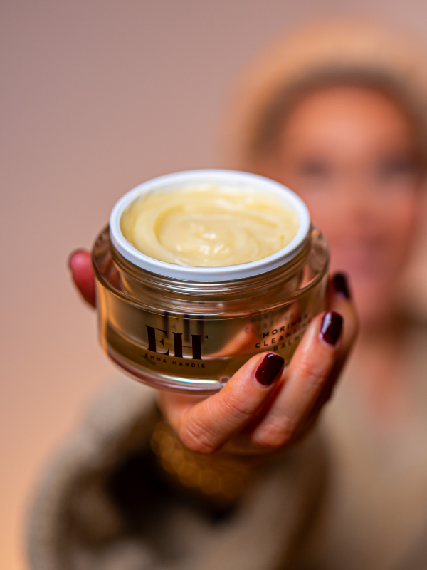 Emma Hardie Moringa Cleansing Balm held open to show its rich, buttery texture.