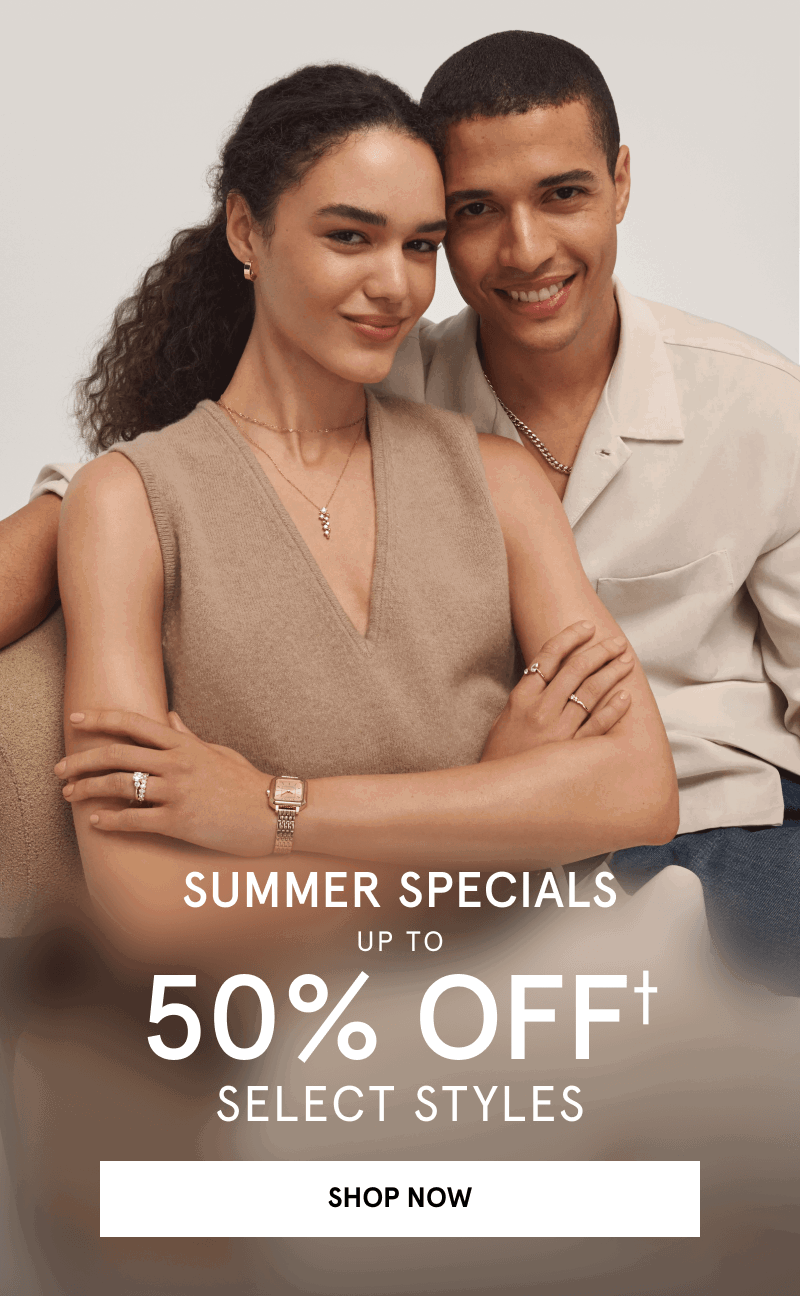 A couple wearing layered  jewelry, rings and a gold toned watch. Summer specials. Click shop now.