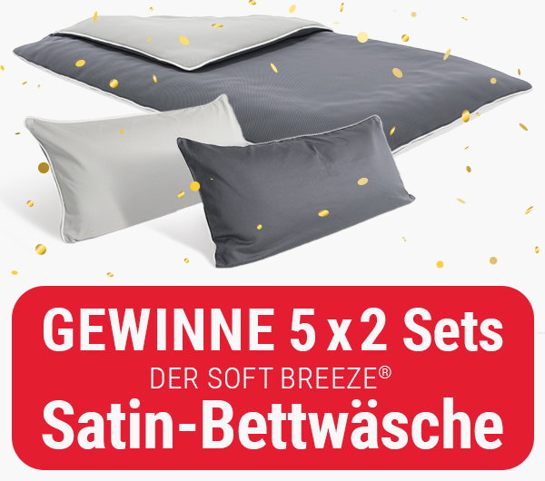 Eine mit der SOFT BREEZE Satin-Bettwäsche bezogenen Bettdecke im Konfettiregen. Davor zwei bezogene Kopfkissen 40 x 80 cm. Text: Gewinne 5 x 2 Sets der SOFT BREEZE Satin-Bettwäsche.