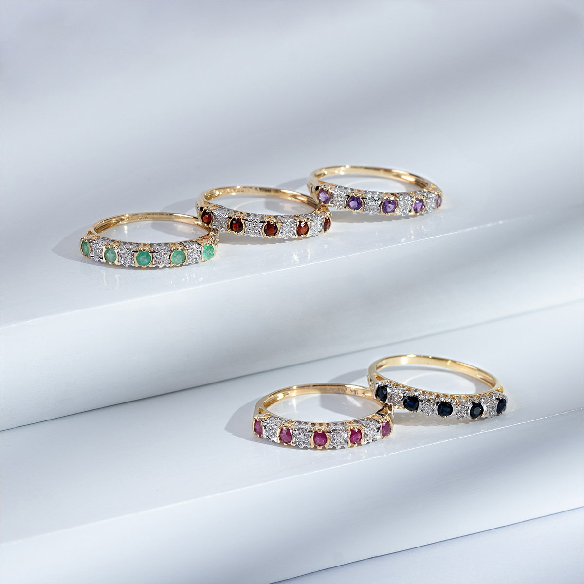 a pair of rings with different colored stones