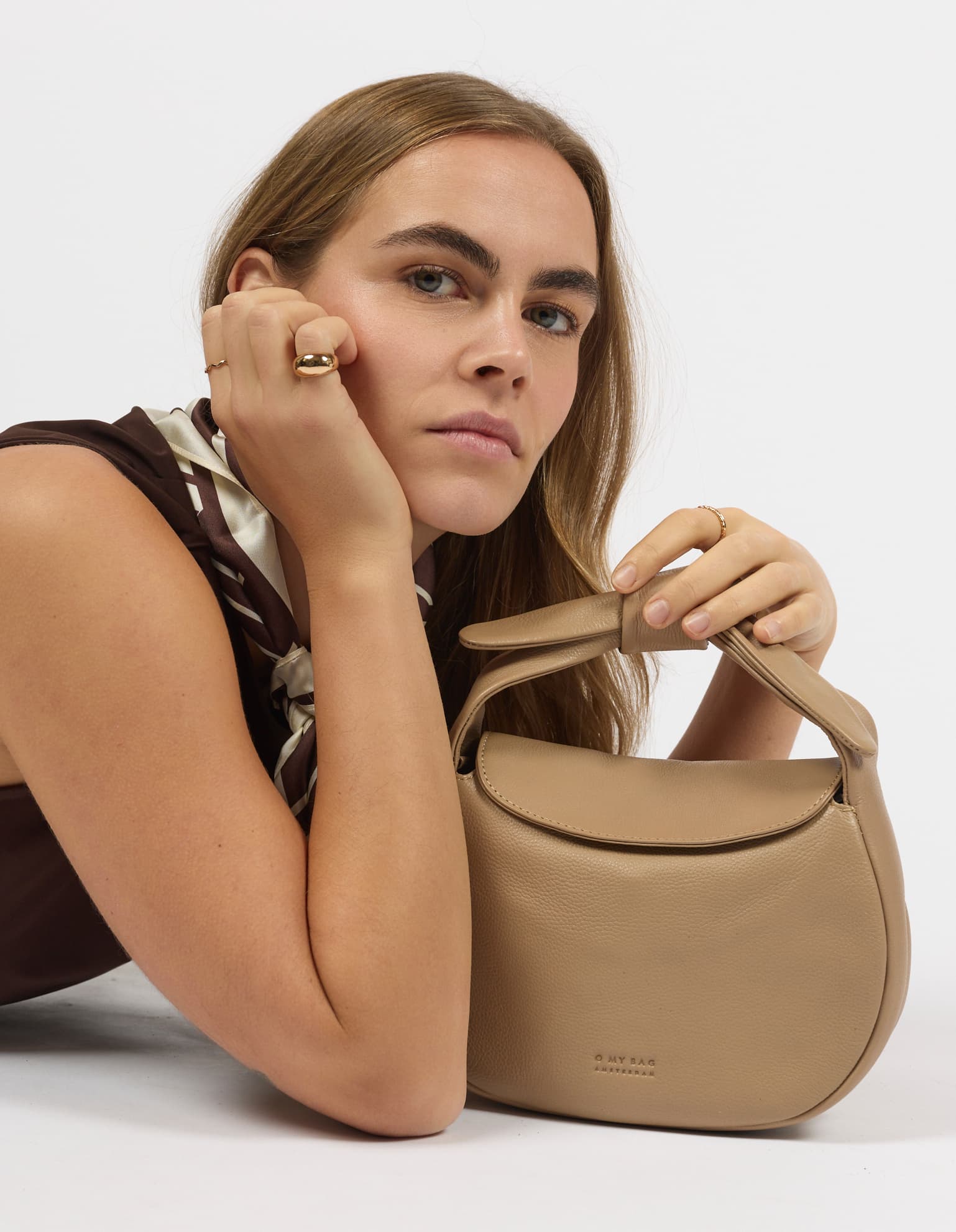 Model wearing Coco bag in Dark Sand