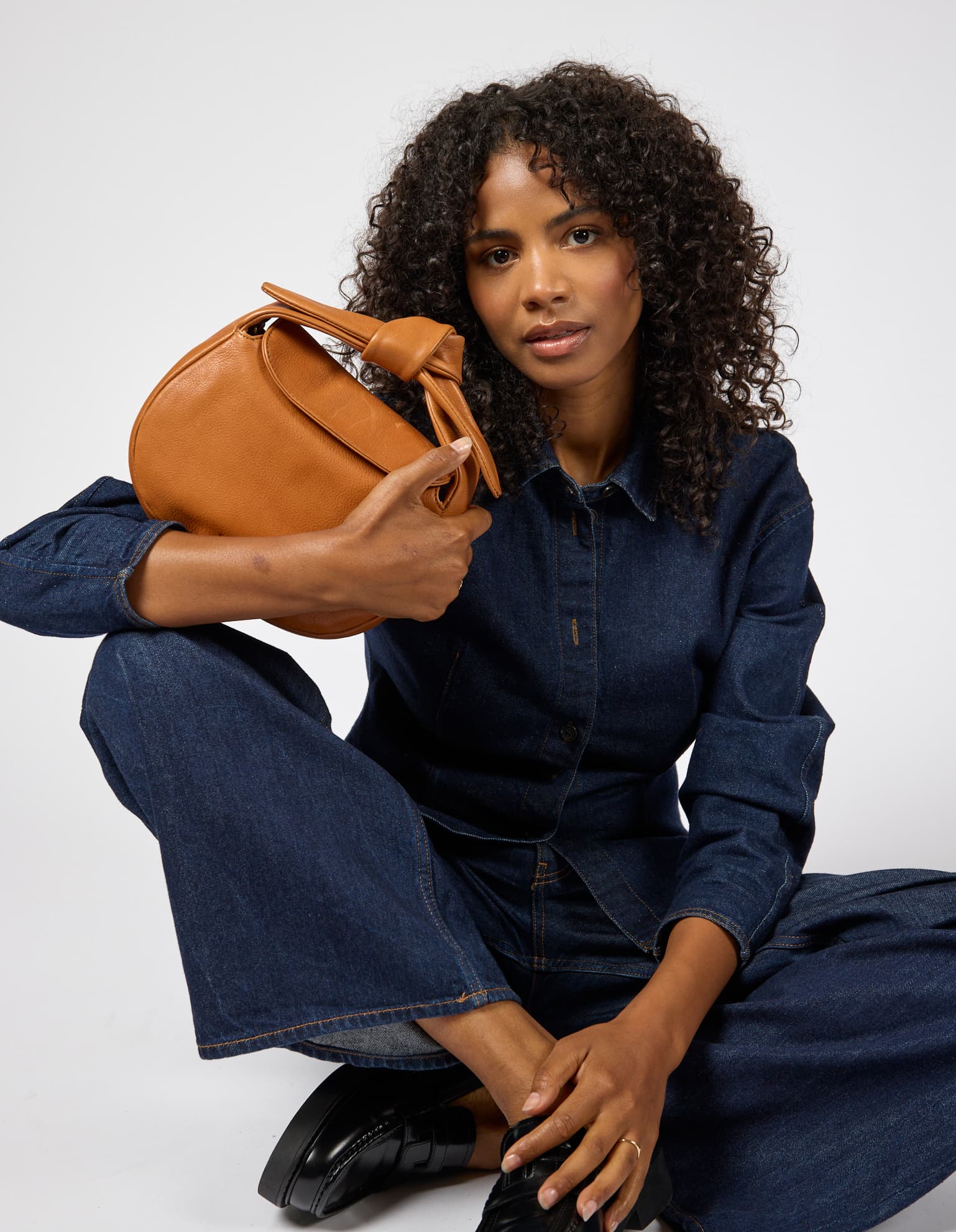 Model wearing Coco bag in Wild Oak