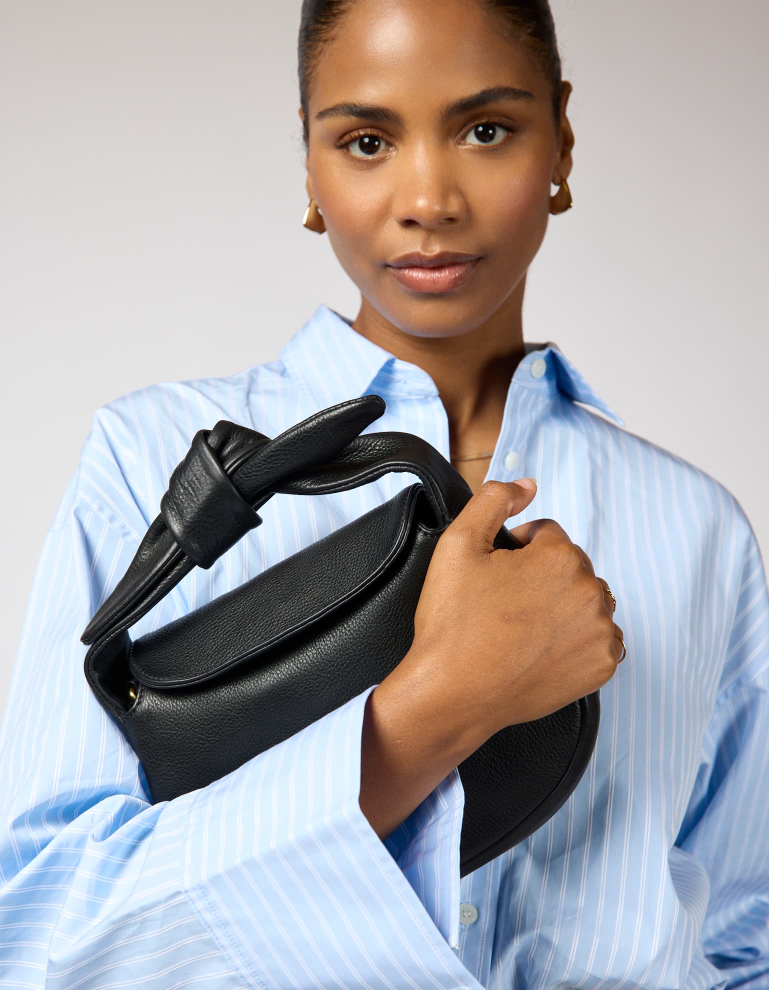 Model wearing Coco bag in Black