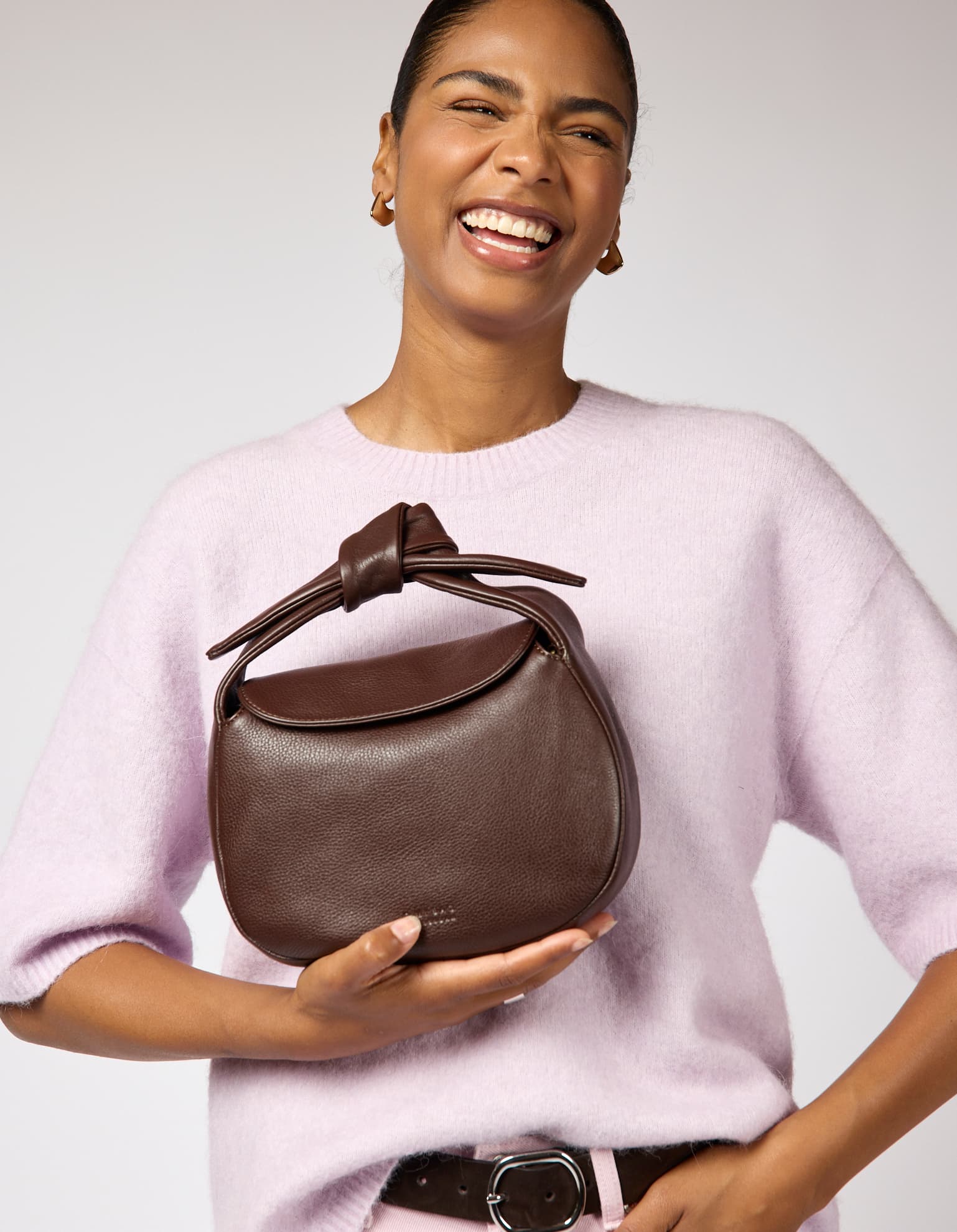 Model wearing Coco bag in Chocolate