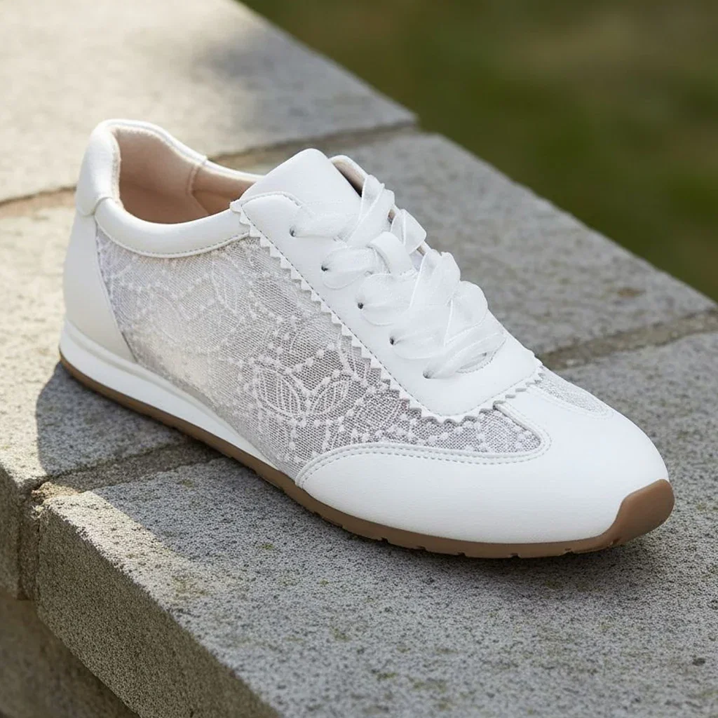 White lace and leather sneaker with white laces on gray stone steps, LifeStride Favorites collection