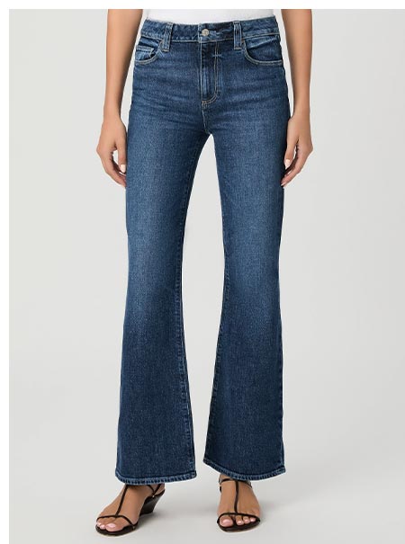 A woman's legs in a medium-dark blue wash denim jeans with flared leg.