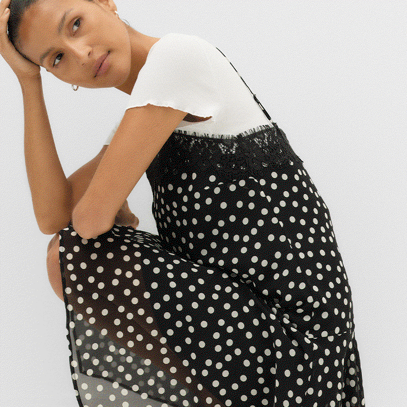 GIF of woman wearing a Black Mix Polka Dot Lace Detail Mini Slip Dress