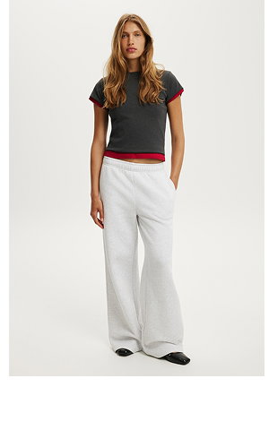Woman wearing black t-shirt and white pants