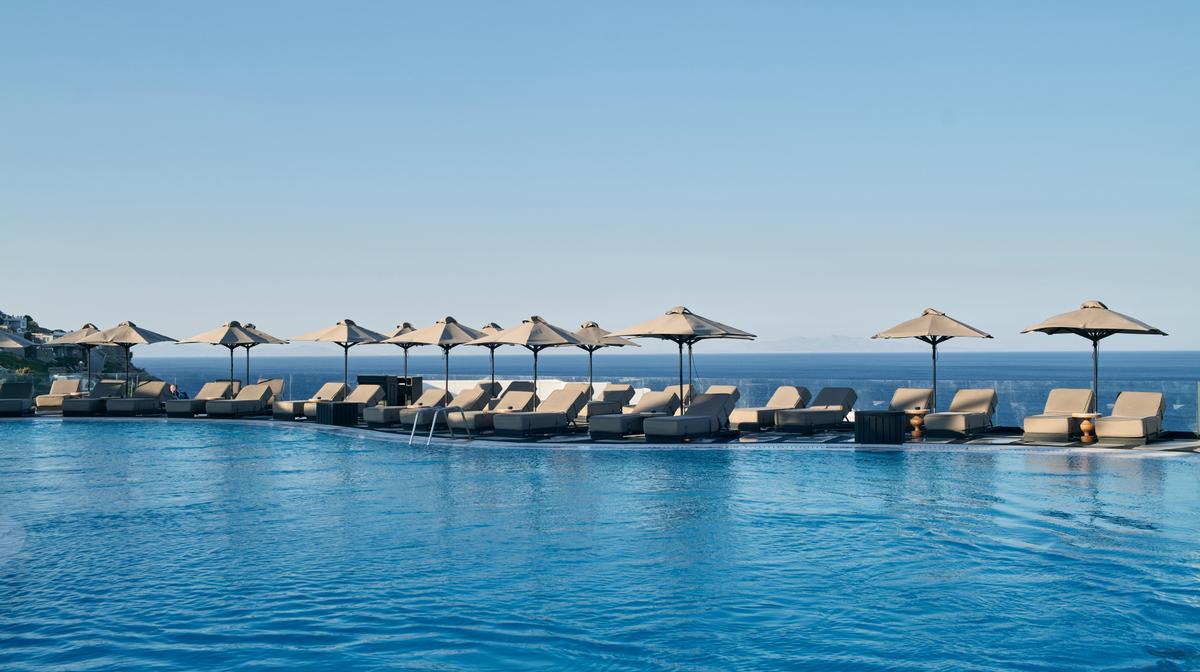 Mykonos Beachfront Luxury with One Dinner, Daily Breakfast & Return Airport Transfers