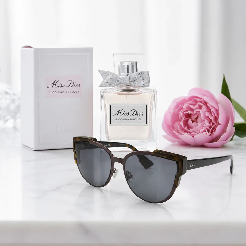 Dior Designer Icons collection featuring Miss Dior Blooming Bouquet perfume, sunglasses, and pink peony flower