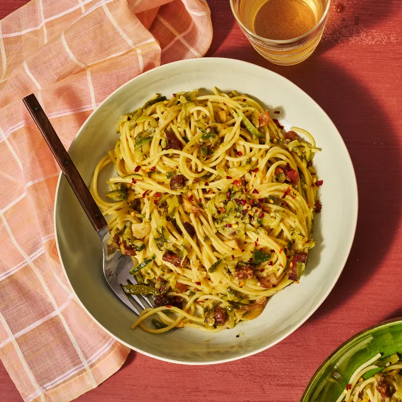 Zucchini Amatriciana beautifully twirled in a stone bowl