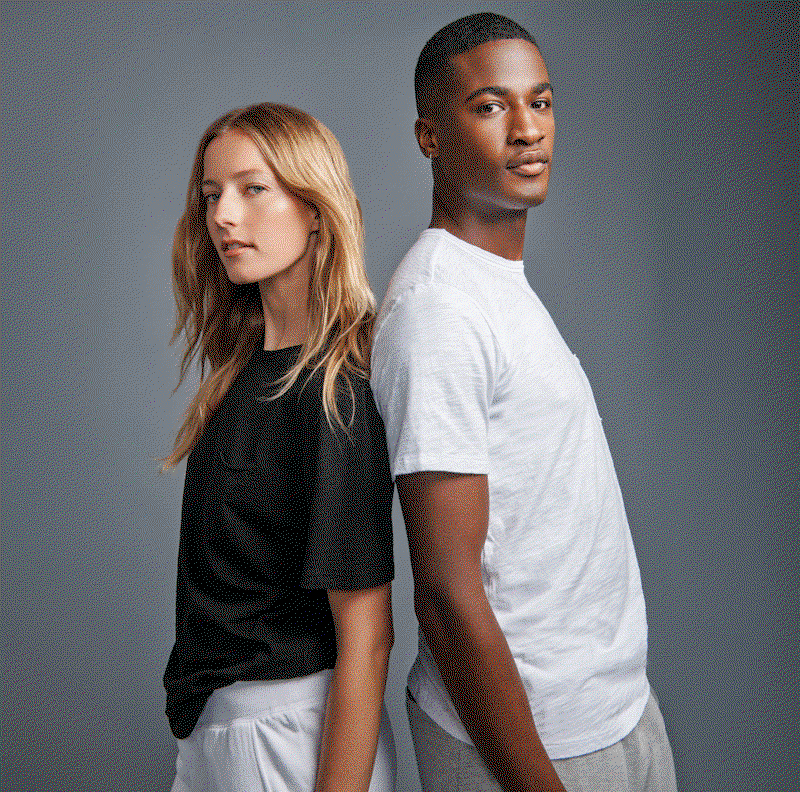 Image shows a model wearing the Marika Top in White. Image shows a model wearing the Howard Top in White. Text reads: Premium fabric you can feel. Made to be worn on repeat. Layer or wear alone.