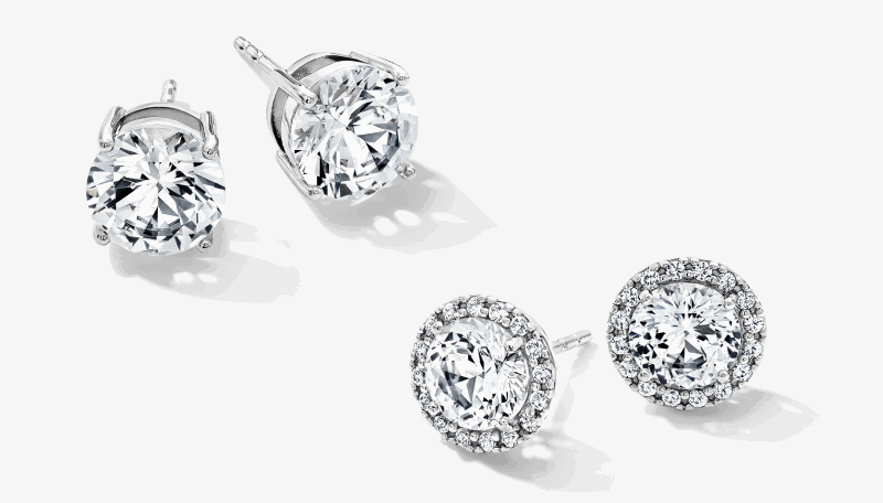 White gold diamond stud earrings in solitaire and halo designs.