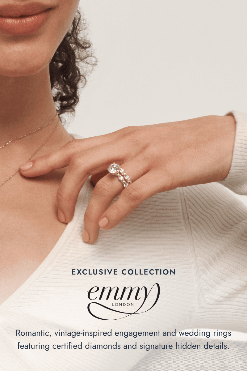 Close-up of woman’s hand wearing yellow gold diamond bridal rings. Exclusive collection. Emmy London.
