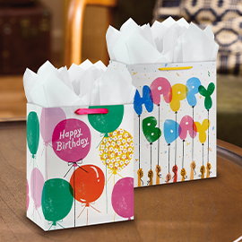 Gift bags on a tabletop.