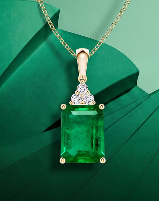 Emerald Pendant With Diamond Trio