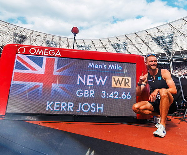 Josh wears custom Brooks race suit & spikes for world record