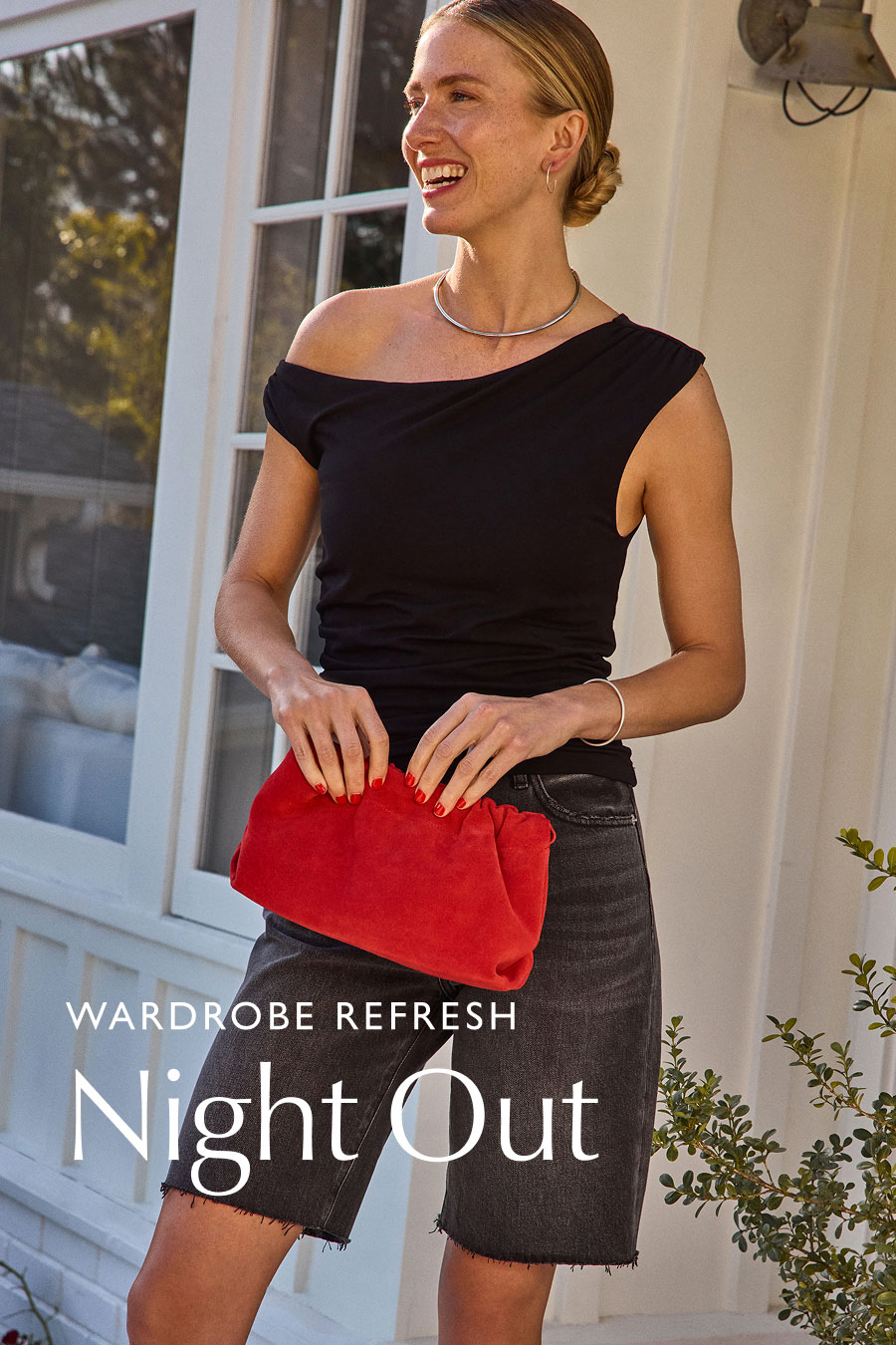 Wardrobe Refresh. Night Out. Image of smiling model in elevated casual night out fashion, dark with a pop of color, from EVEREVE.
