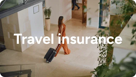 Person walking in lobby with a suitcase