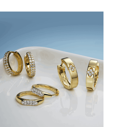 Assorted yellow gold hoops earrings and huggies with diamond accents and pavé settings
