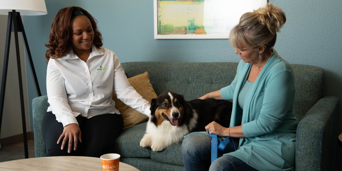 Woman at WoodSpring Suites with her dog