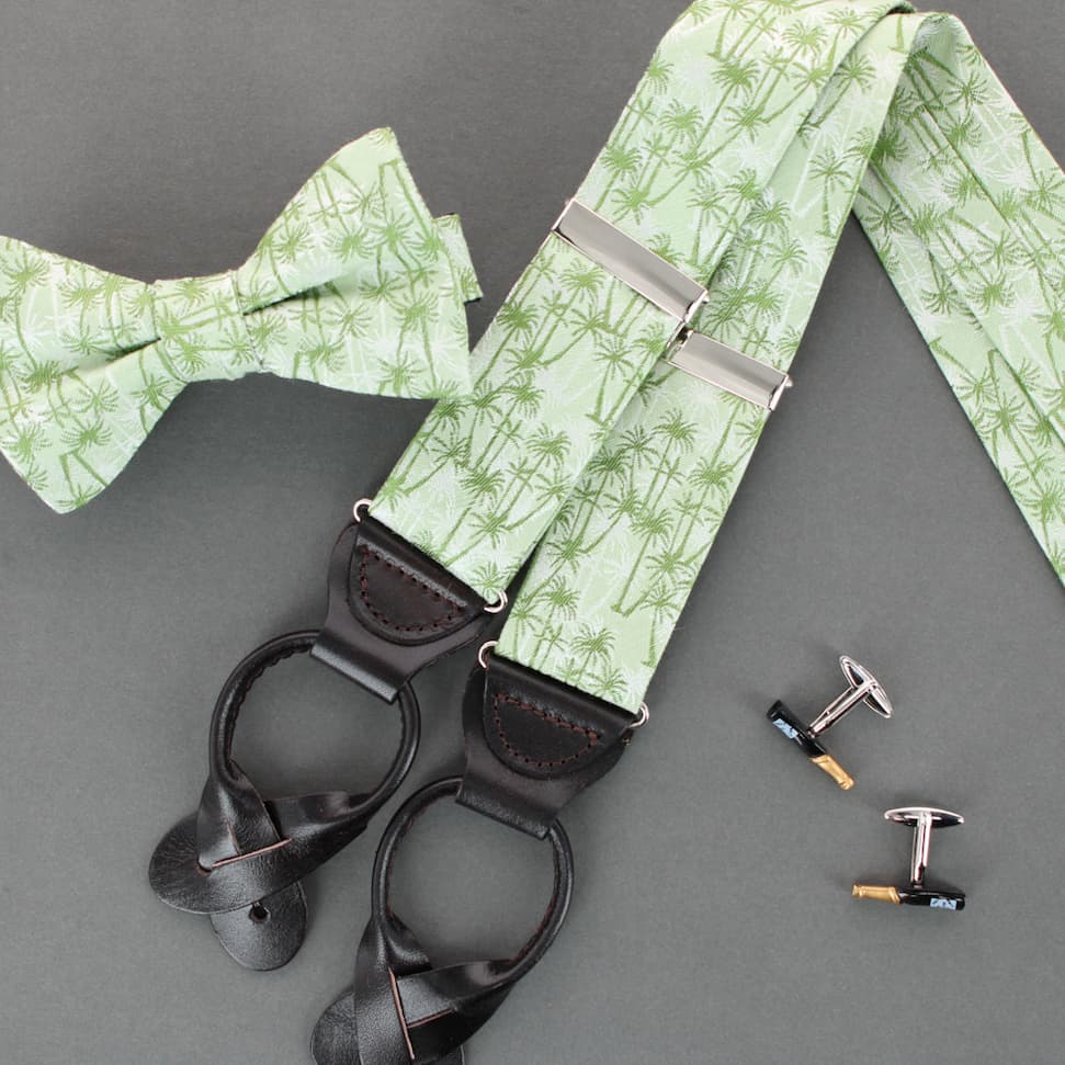 Champagne cufflinks and palm tree braces and bow ties