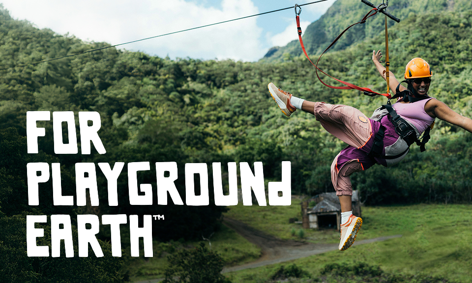 A person zip-lining with overlayed block white text reading 'For playground earth'