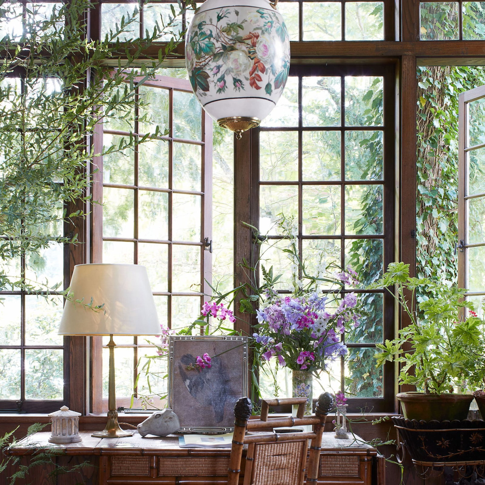 Image courtesy of architectural digest, with flowers and a beautiful sitting space in Adam's home 