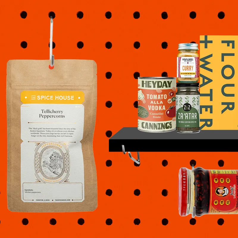 pantry starter kit with black peppercorns, heyday canning co tomato alla vodka beans, flour and water pasta, burlap and barrel curry powder, z and z za'atar, lao gan ma chili crisp, and king arthur all purpose flour