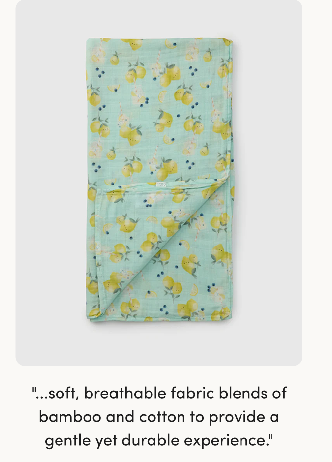 blue muslin swaddle printed with lemons and blueberries