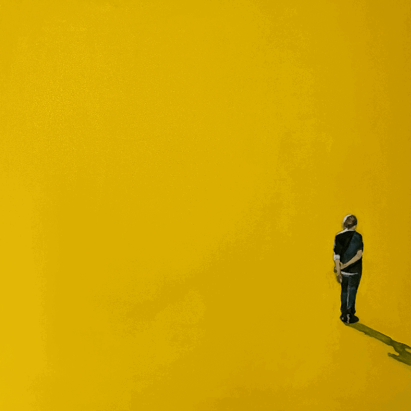 Yellow painting woman standing in corner
